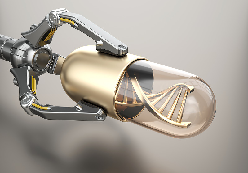 機器人手臂上有帶DNA的金色藥丸圖片素材