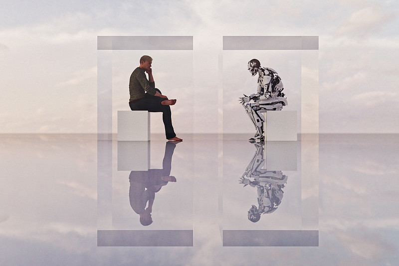圖靈測試:機器人和人類面對面坐在立方體中圖片素材