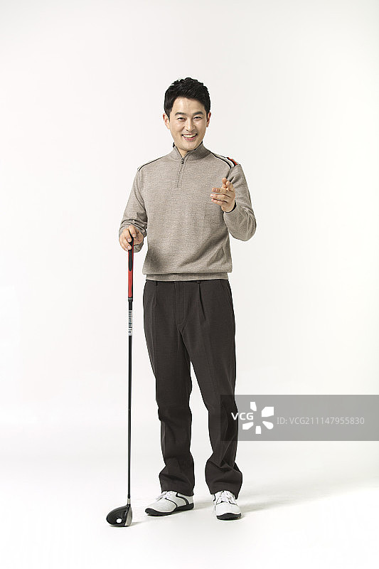 微笑的男性高尔夫球孤立在白色的背景图片素材