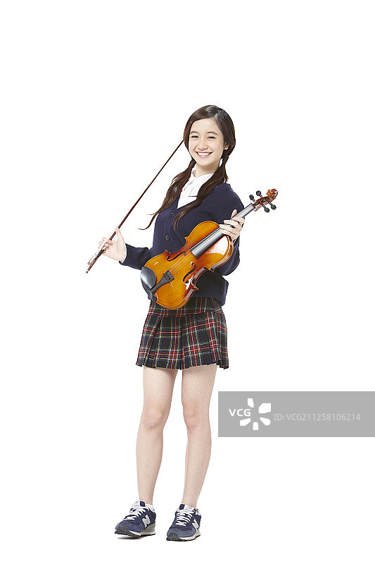 穿着校服拉小提琴的少女摄影图片素材
