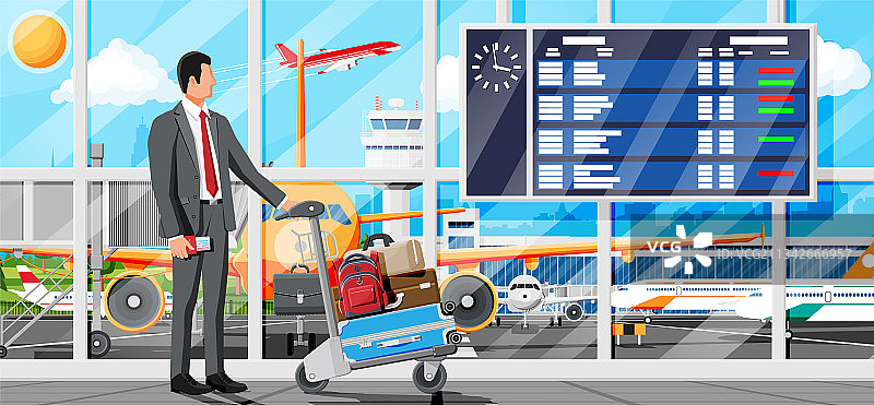 一个男人和一辆装满行李的手推车停在机场图片素材