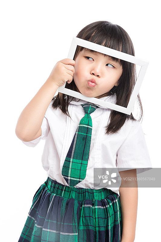 手拿白色相框的亚洲小女孩图片素材