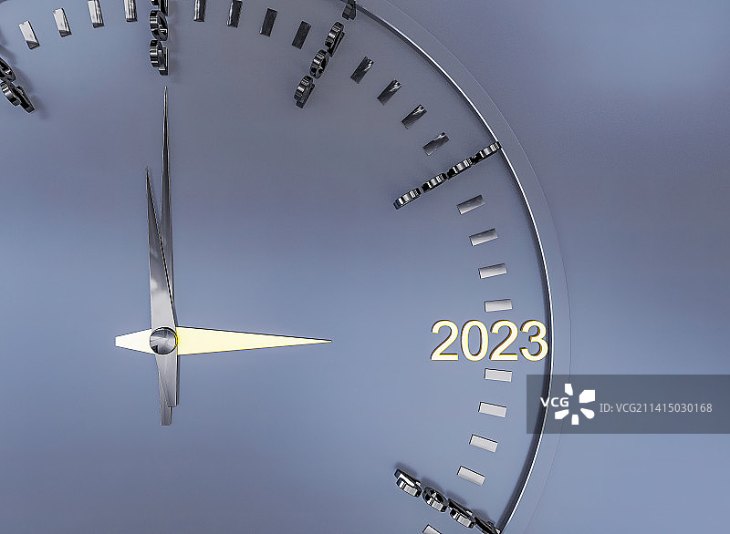 灰色背景的2023年年轮时钟表特写图片素材