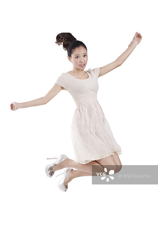 Young woman jumping,smiling图片素材