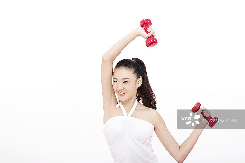 青年女性用哑铃健身图片素材