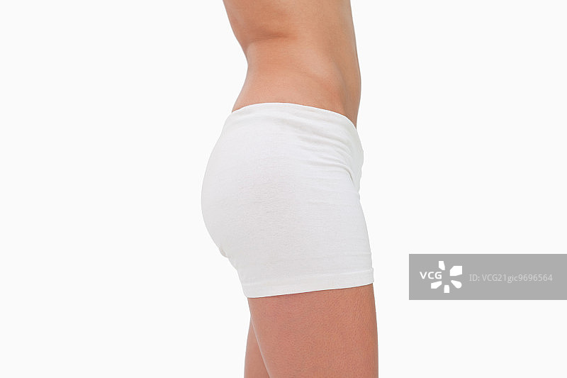 侧视图苗条的臀部对白色的背景图片素材