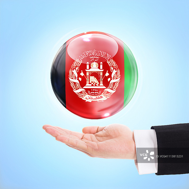 一只手扶着阿富汗国旗图片素材
