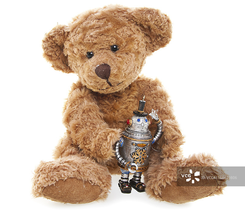 可爱的泰迪熊和玩具机器人，坐着，孤立在白色图片素材