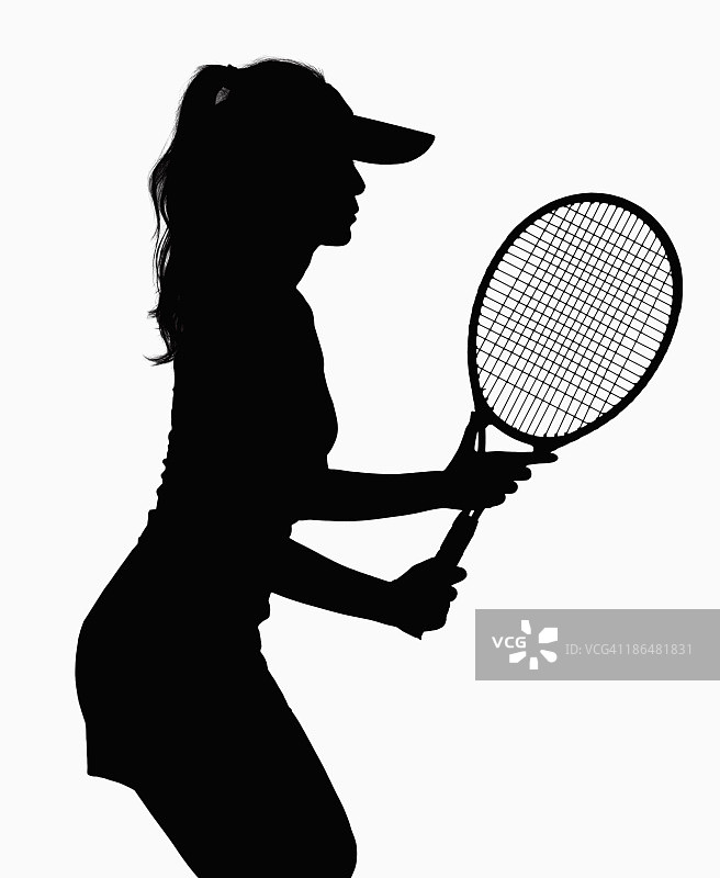 女人的剪影与网球拍。图片素材
