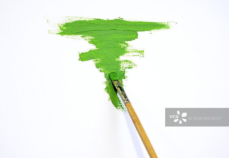 白色画布上的绿色线条和油画颜料图片素材