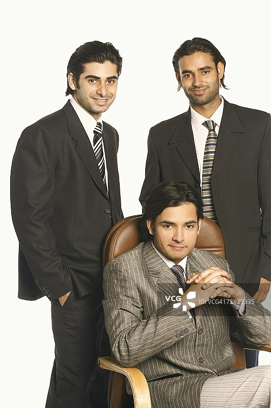 三个商人微笑的肖像图片素材