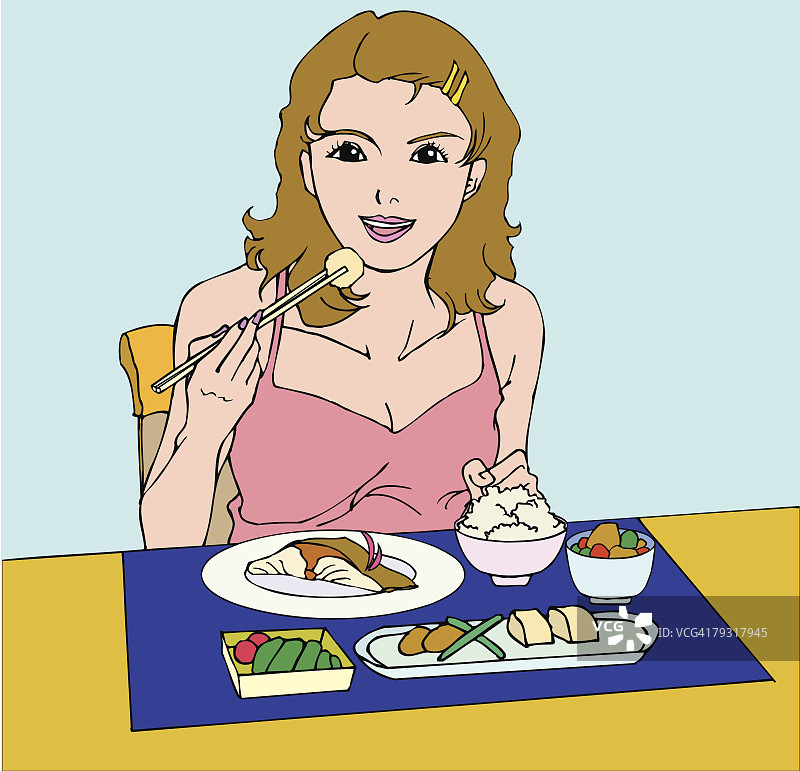 女人用筷子吃健康的食物，微笑着，正面看图片素材