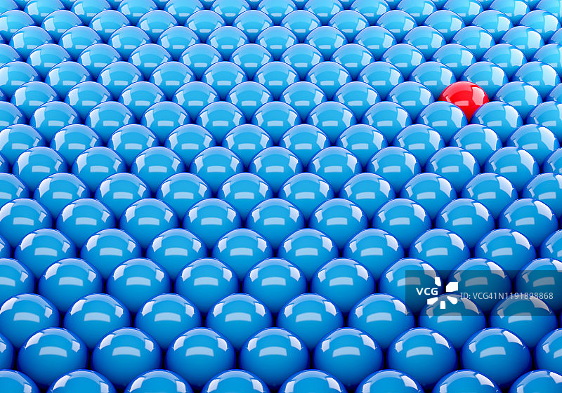 一个红球在蓝色中另一个。不同独特的领导领域成功的企业。三维渲染图片素材
