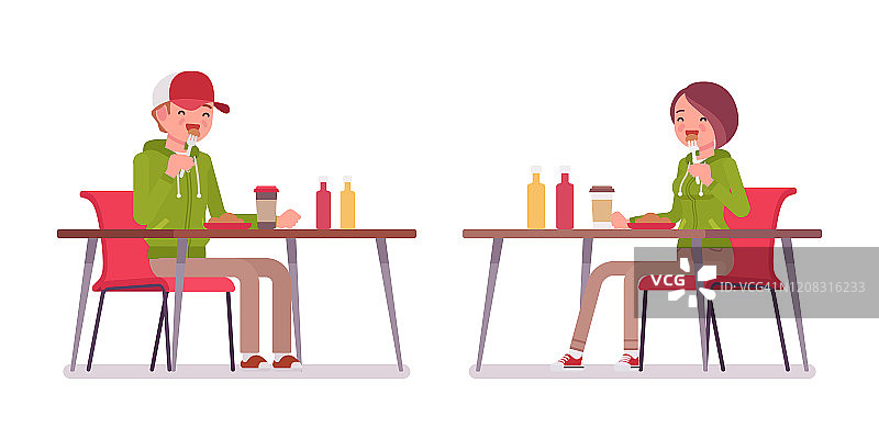 年轻的男人和女人在餐厅的桌子上吃午饭图片素材