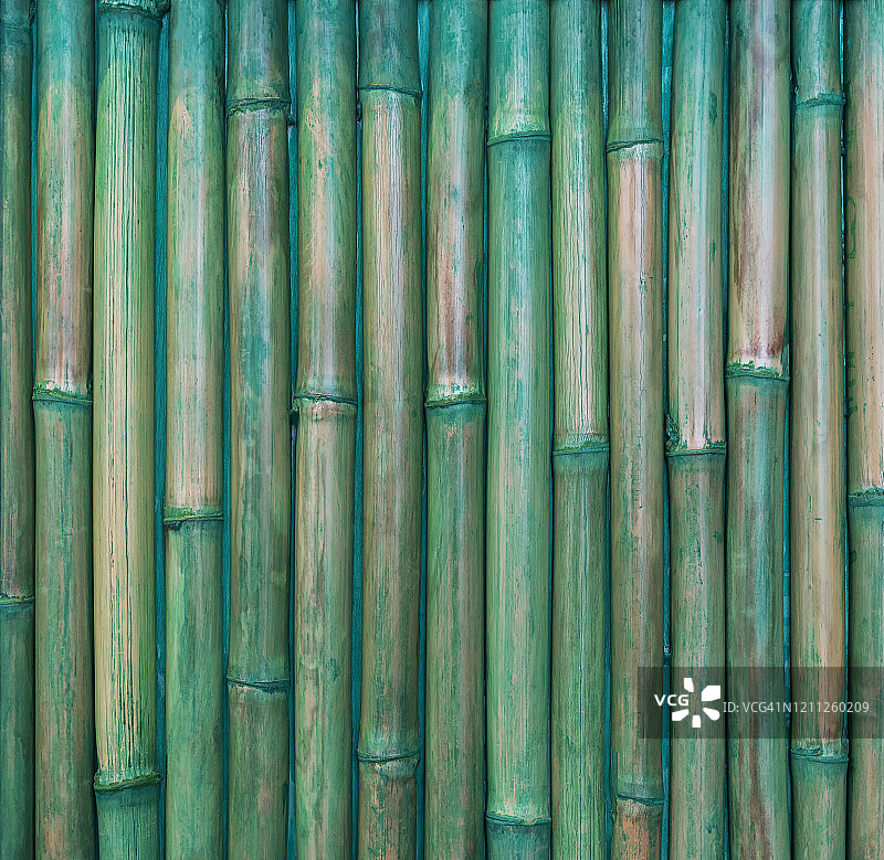 抽象的背景从竹图案墙与绿色油漆。复古样式。图片用于添加文字信息。设计艺术作品的背景。图片素材