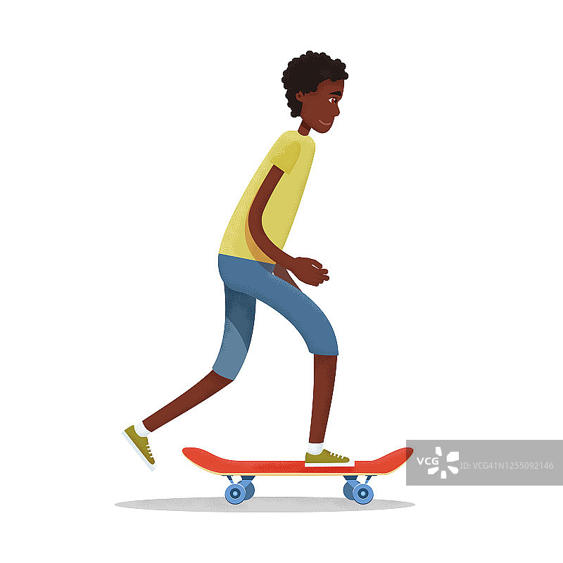 穿着短裤和t恤的非洲裔美国少年骑着红色的滑板。图片素材