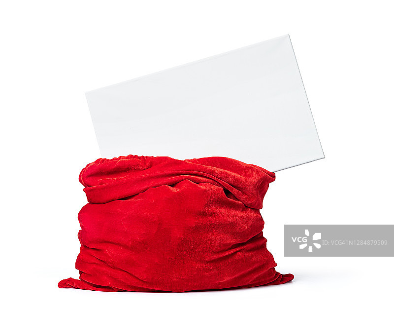红色的圣诞老人袋与白色空白横幅文字在上面，孤立的白色背景。文件包含隔离的路径。图片素材