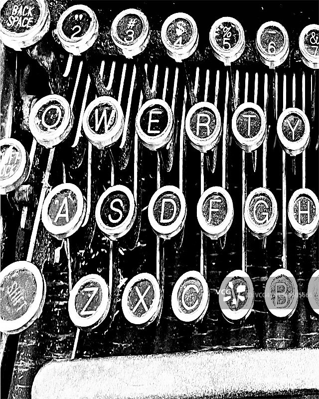 古董手动打字机上的单色背景键-库存照片图片素材
