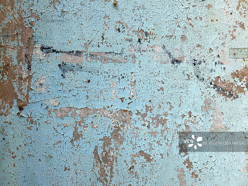 布鲁塞尔，混凝土墙上的蓝色油漆被刮花和风化图片素材