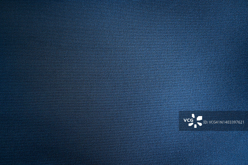 深蓝面料布料涤纶质感和纺织背景。图片素材