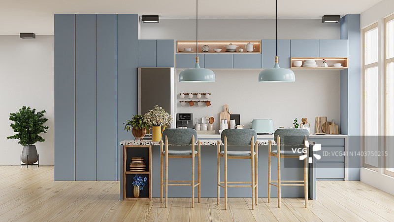 现代蓝色厨房内部家具，厨房内部白色墙壁。图片素材