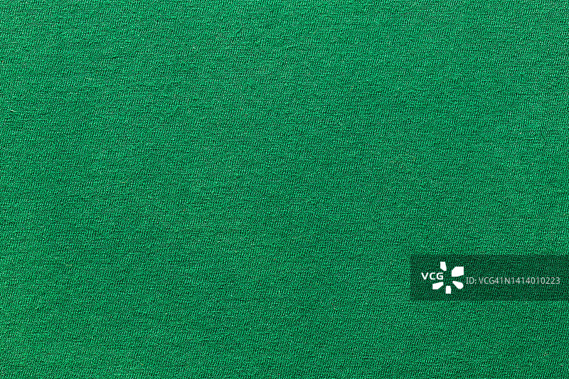 服装绿色面料纹理背景，布料纺织品表面的俯视图图片素材