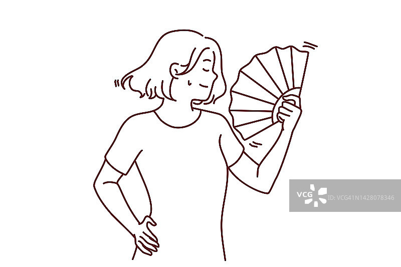中暑妇女使用手扇图片素材