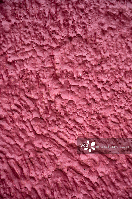 粗糙的混凝土粉刷墙漆成锈红色图片素材