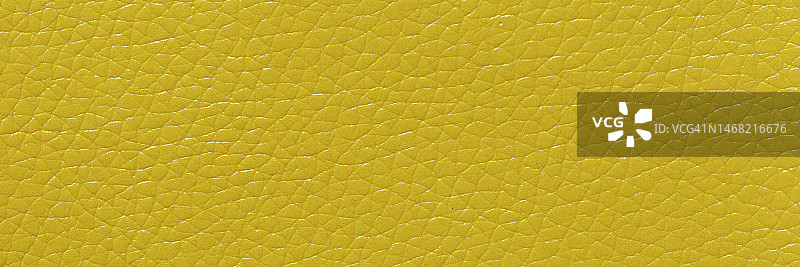 黄色皮革和纹理背景与复制空间的设计。宽横幅。图片素材