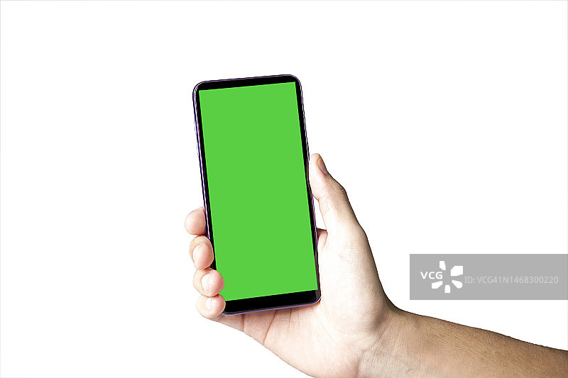 手持智能手机，绿色屏幕。图片素材