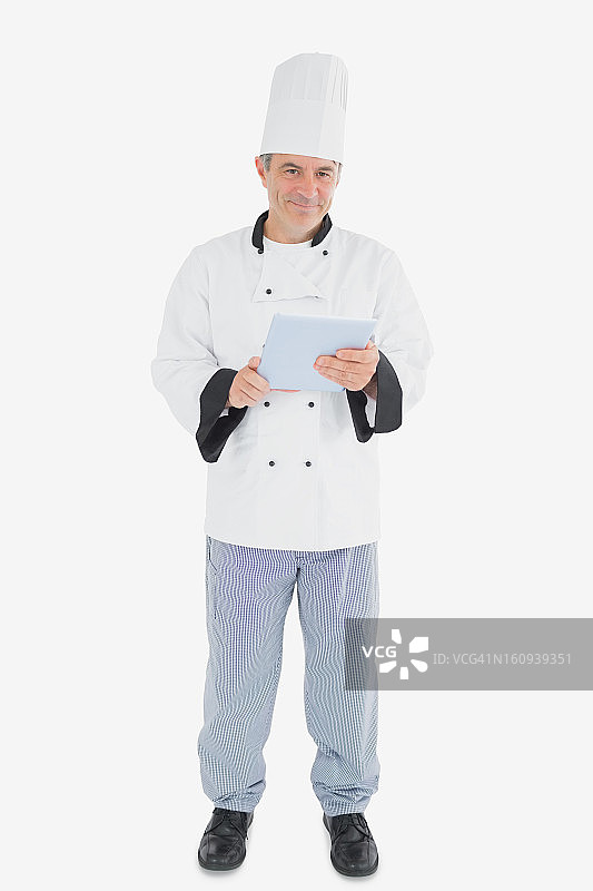 男厨师手持数码平板电脑的肖像图片素材
