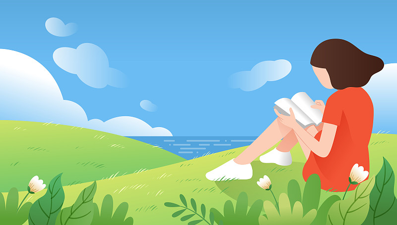 一个女生坐在海边的山坡上看书图片素材