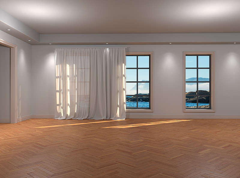 阳光透过窗户洒满海边度假别墅的房间的内部图片素材
