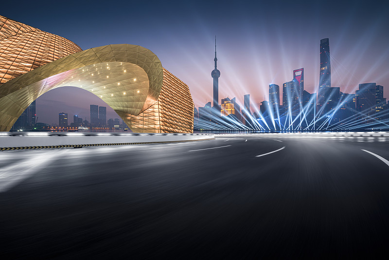 大湾区上海科幻时尚未来城市天际线大转弯运动模糊的公路夜景图片素材