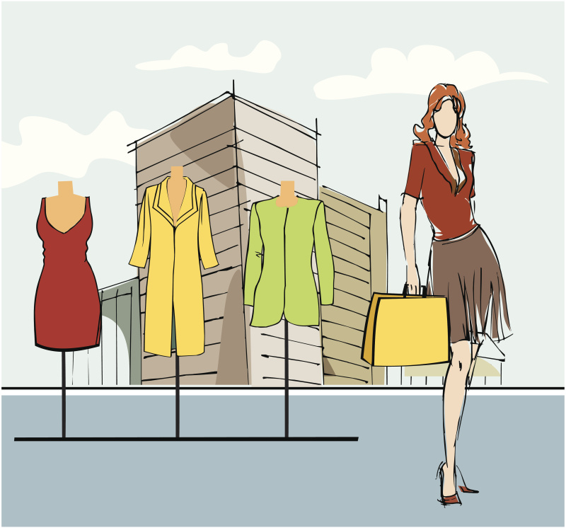 一个拿着购物袋站在服装店外面的女人图片下载