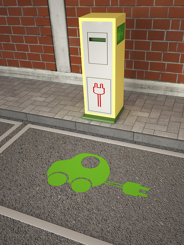 电动汽车充电站，绿色汽车标志上的沥青图片下载