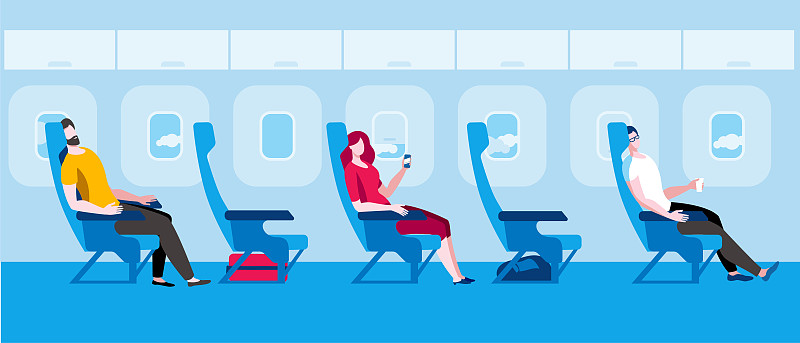 人们坐在飞机上。在流感大流行期间乘坐飞机旅行。图片下载