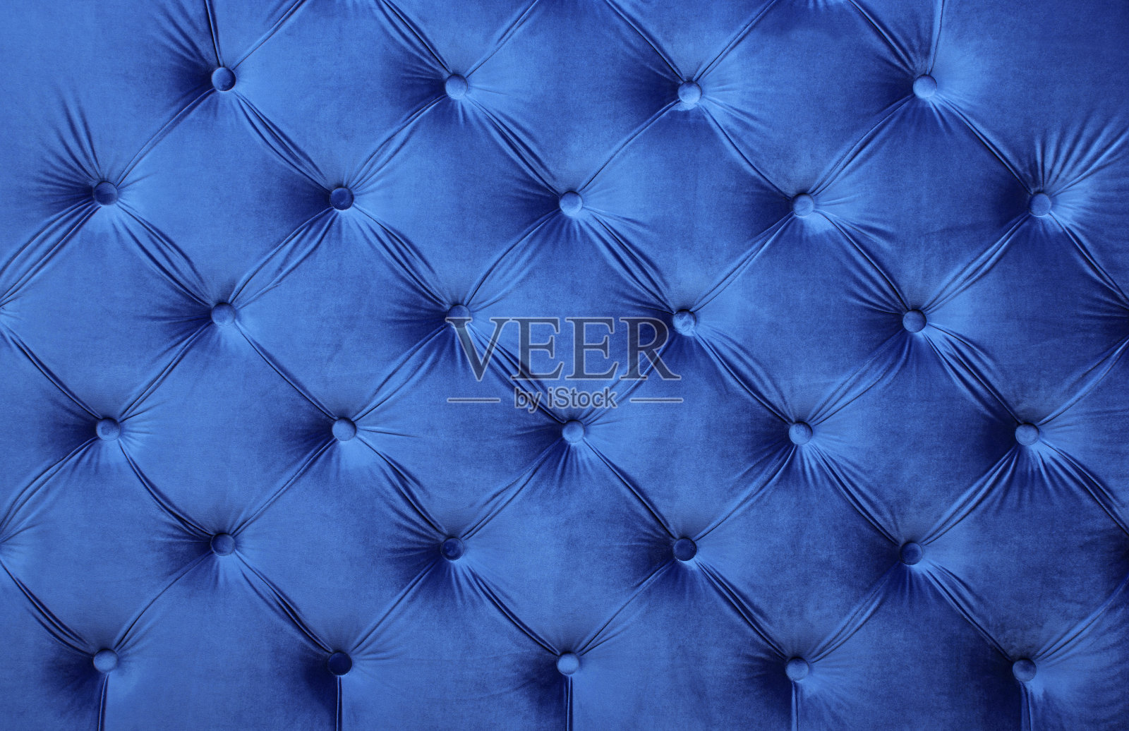 蓝色天鹅绒capitone纺织背景，复古切斯特菲尔德风格照片摄影图片