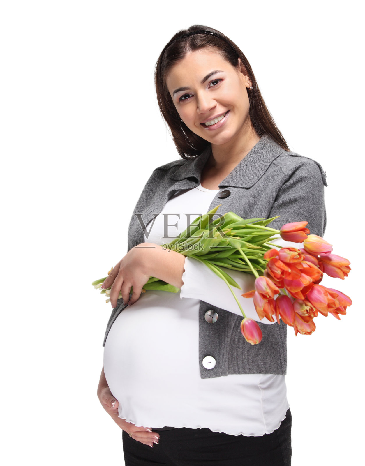 抱着郁金香的快乐孕妇照片摄影图片