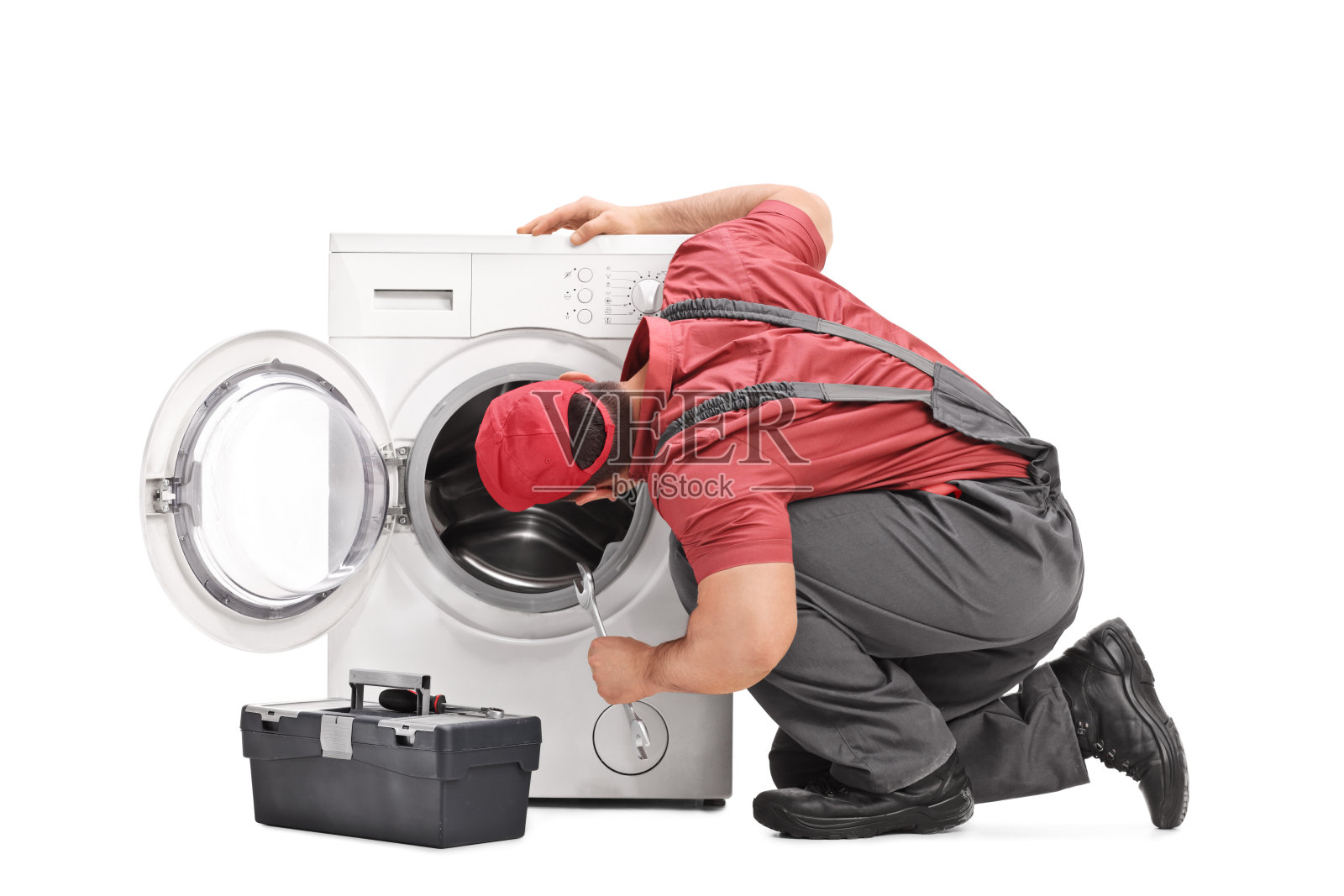 修理工检查洗衣机照片摄影图片