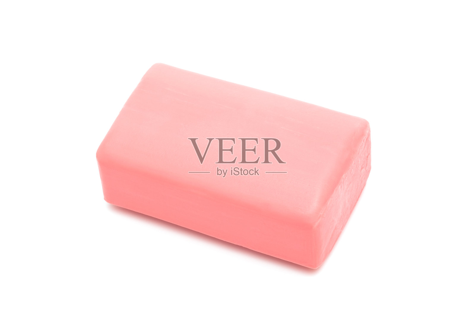 白色背景下的一块长方形的粉红色肥皂照片摄影图片