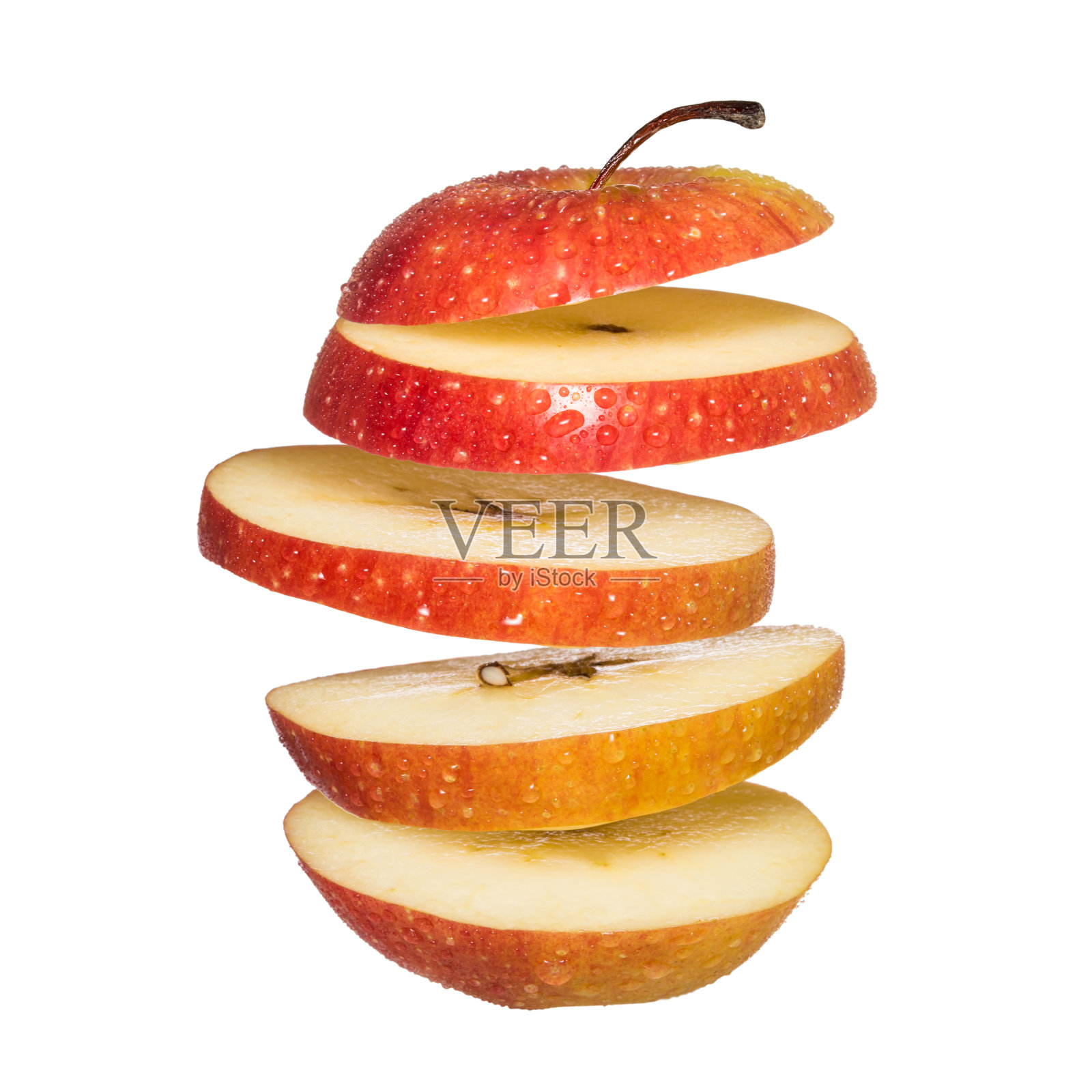飞苹果。切片红苹果孤立在白色背景。照片摄影图片