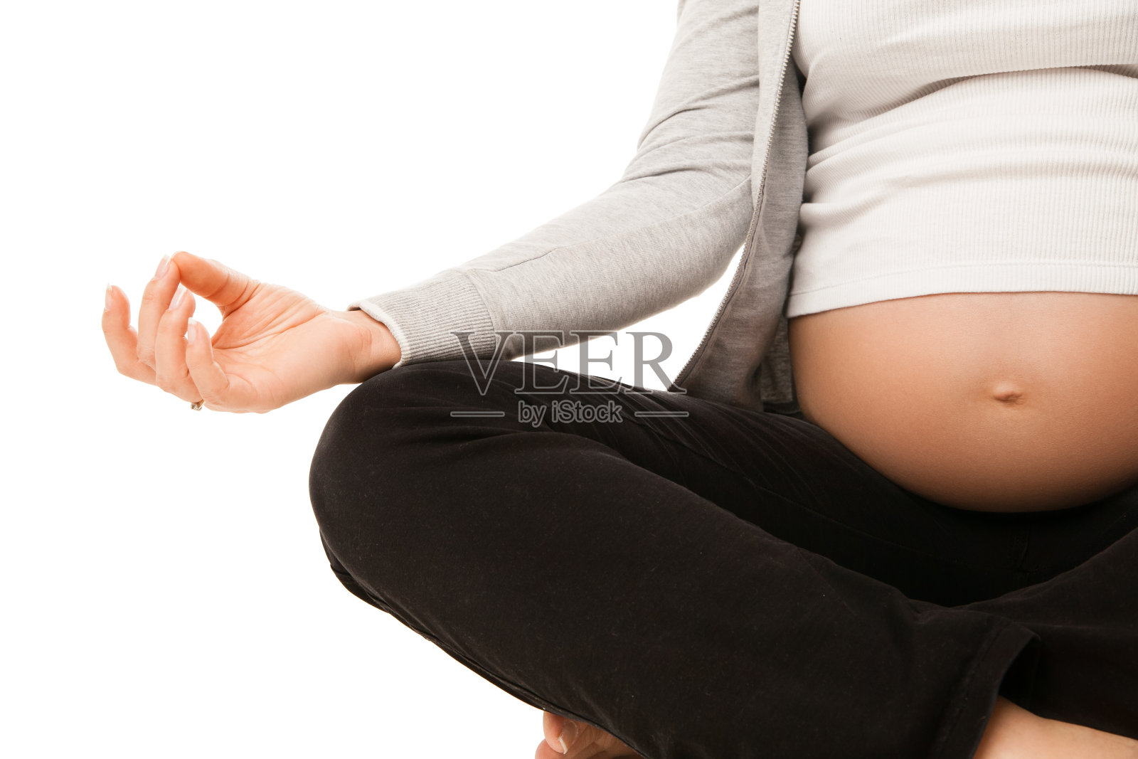 孕妇在白色皮肤上做瑜伽放松照片摄影图片
