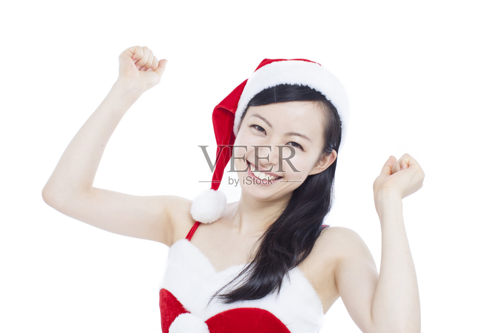 穿着圣诞老人衣服的快乐女人照片摄影图片
