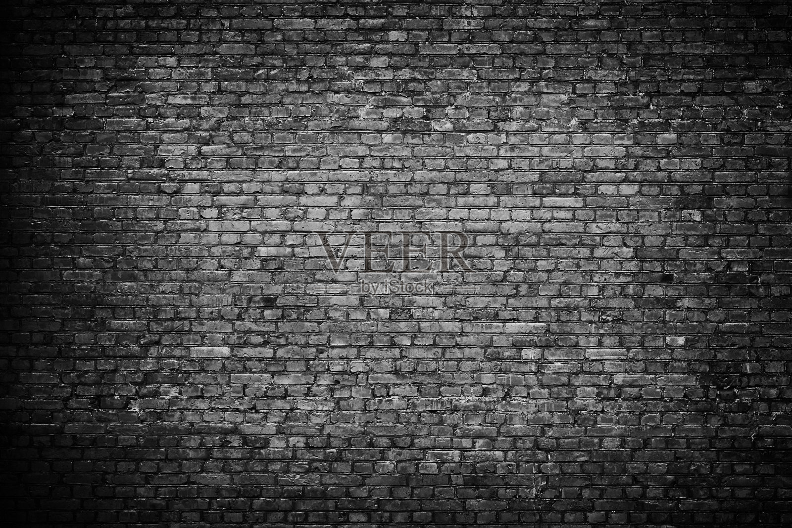 旧的黑色砖墙背景。背景图片素材