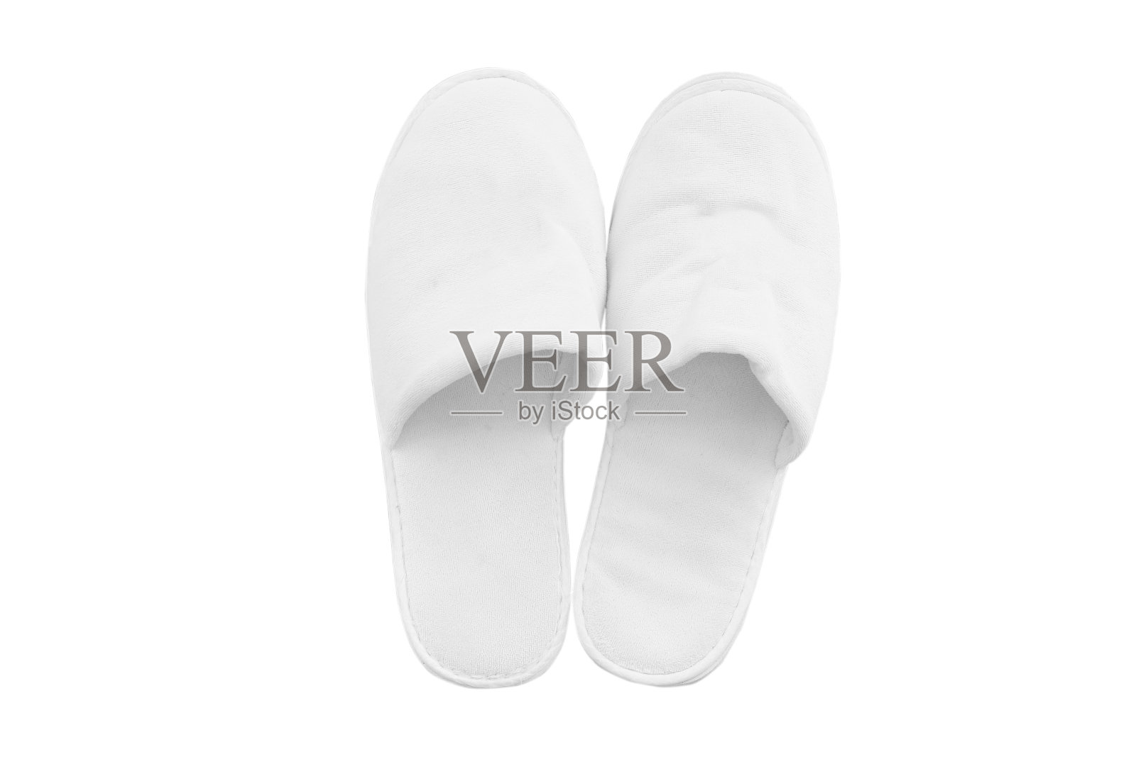 白色舒适的拖鞋隔离在白色背景。照片摄影图片