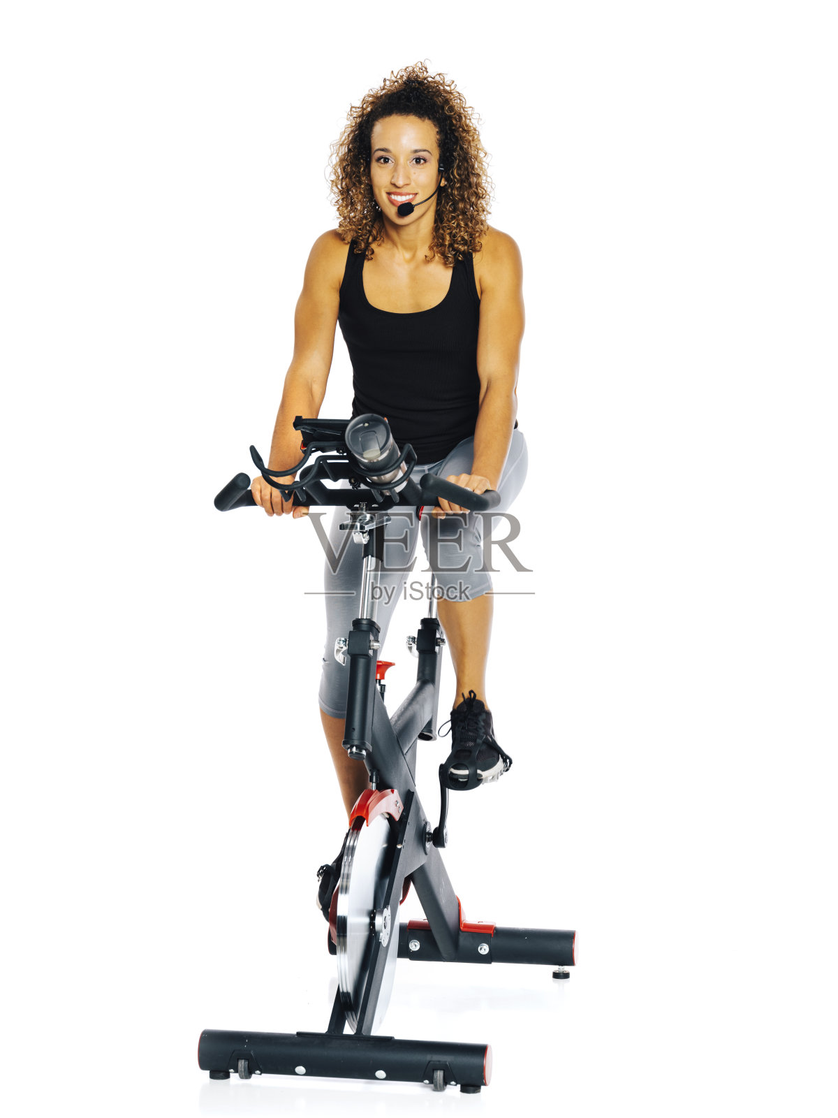 骑健身自行车的女人照片摄影图片