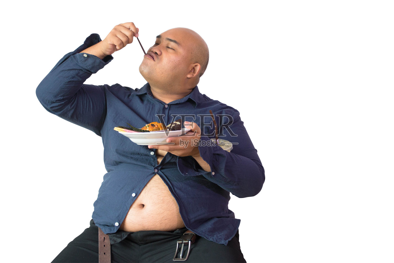 亚洲胖子吃零食照片摄影图片