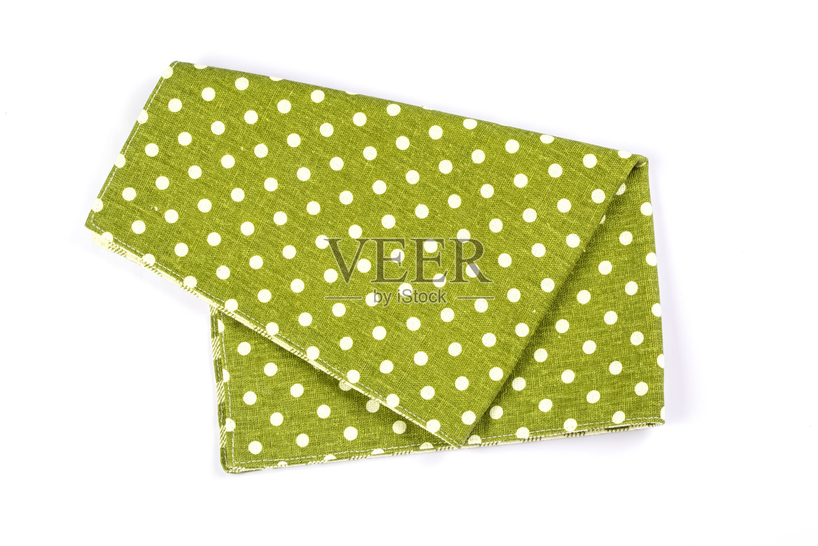 白色背景上的绿色圆点格子餐巾桌布。照片摄影图片