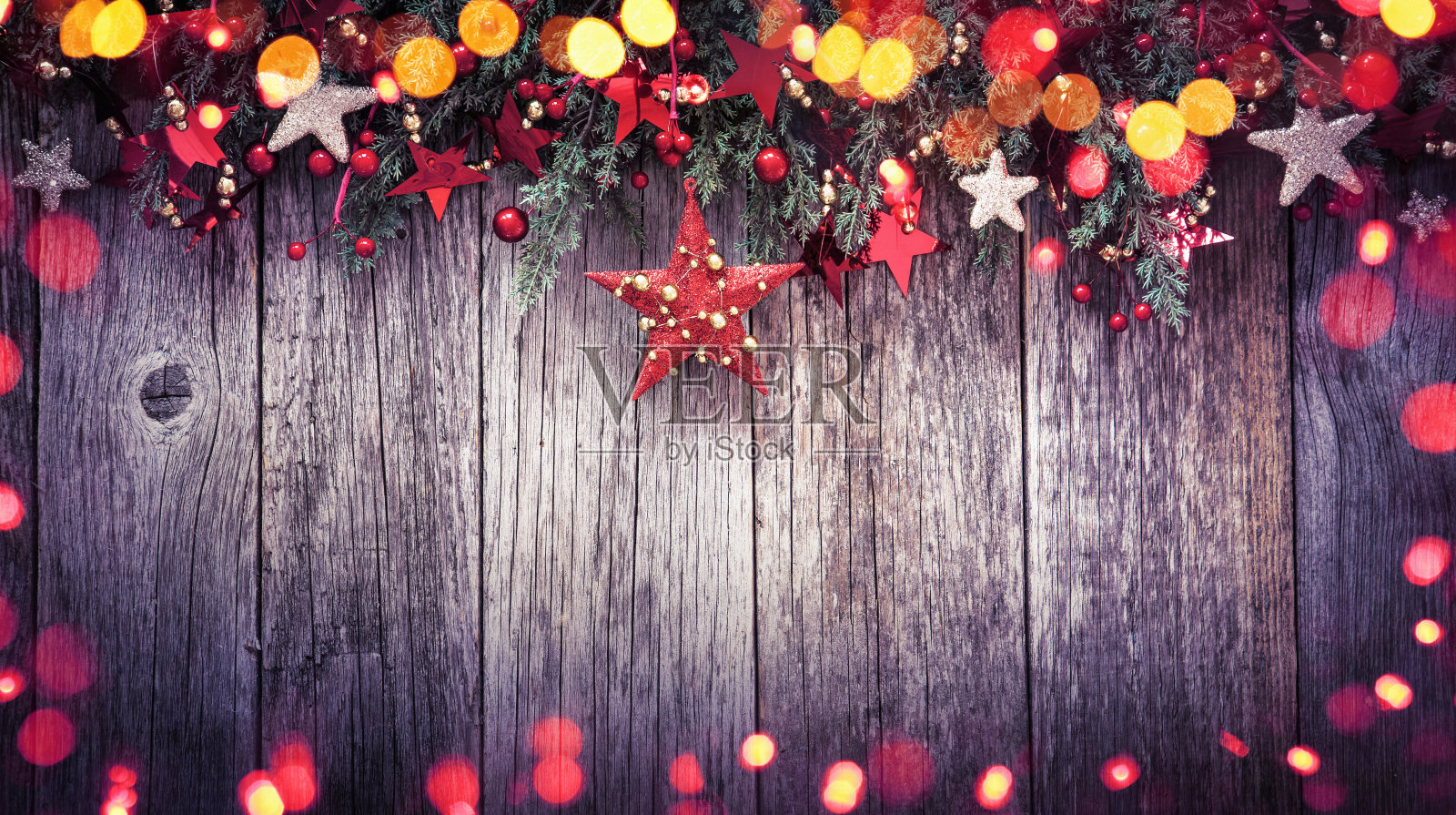 节日装饰圣诞星与彩色灯光效果照片摄影图片